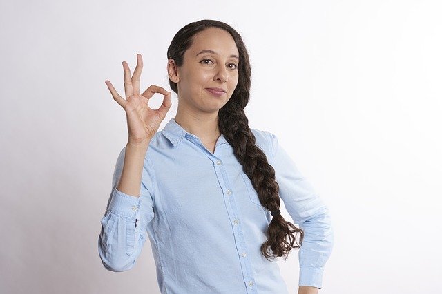 person making OK sign with their hand