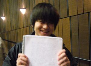 smiling student with paper